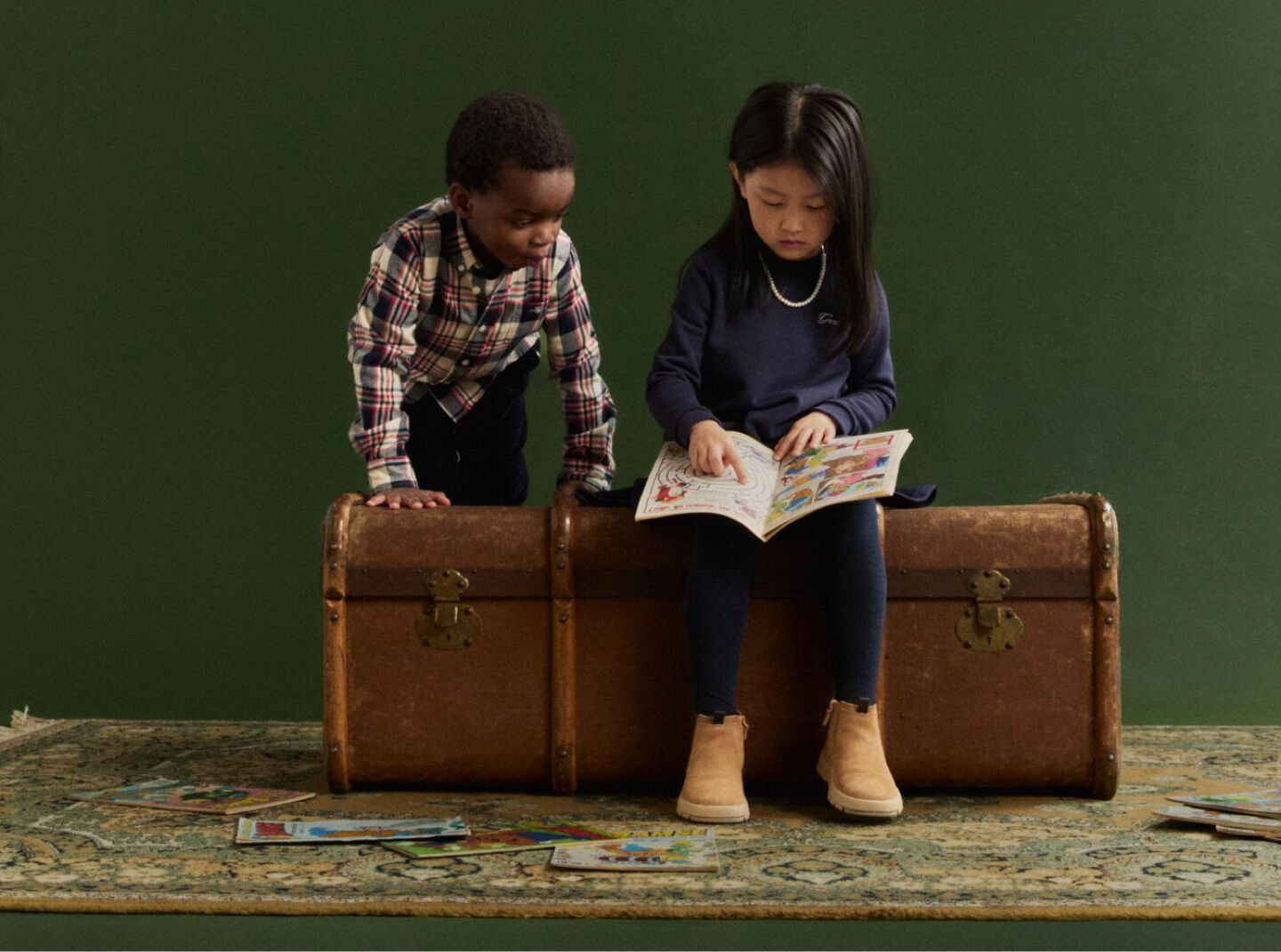 Kids looking at a book