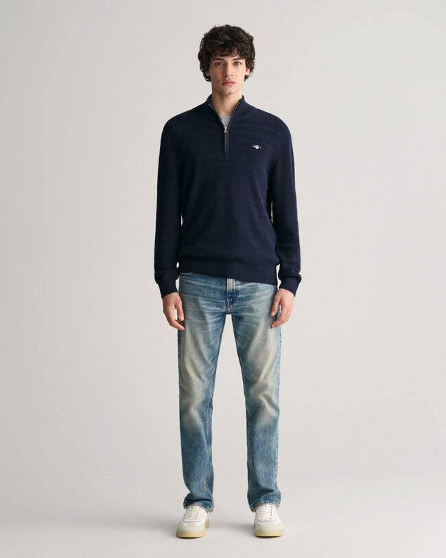 Raidallinen kohopintainen vetoketjukauluksellinen puuvillaneule