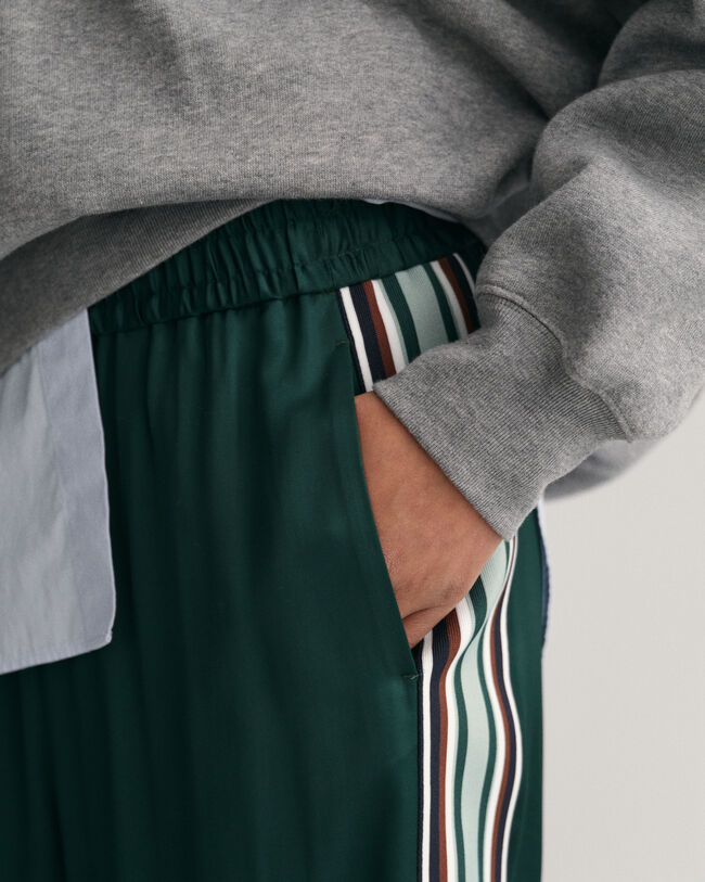 Relaxed fit -mitoitetut huolettomat raitahousut