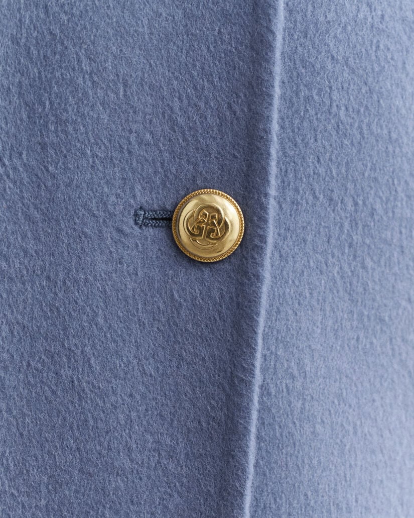 Käsin tikattu kansitakki