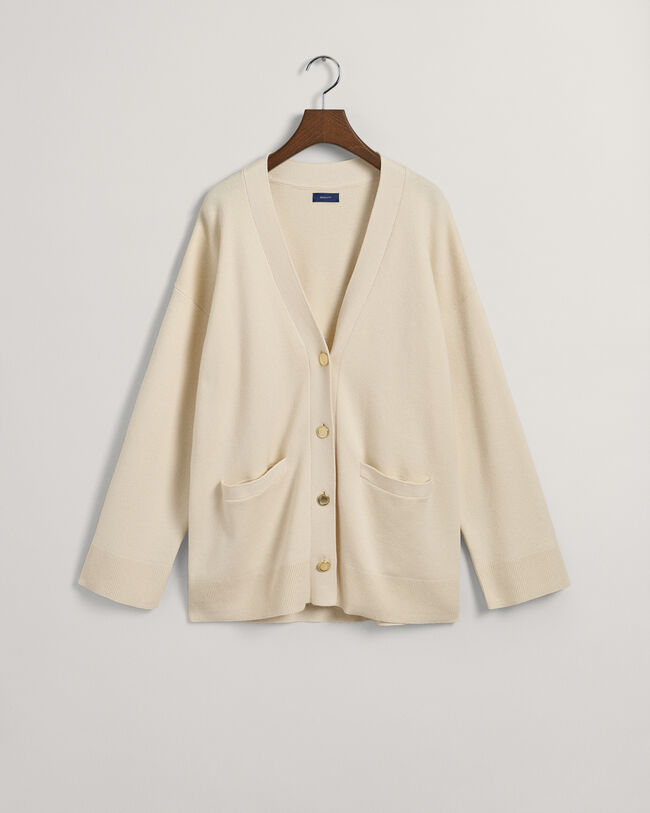 Relaxed fit ‑mitoitettu neuletakki, jossa v-p&auml;&auml;ntie