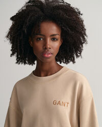 Logolla varustettu v&auml;lj&auml; pitk&auml;hihainen mekko