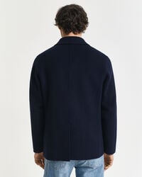 Käsin tikattu klubitakki