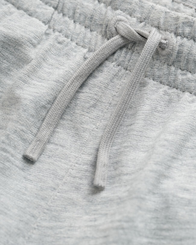 Teens-malliston slubipuuvillaiset Shield-collegeshortsit