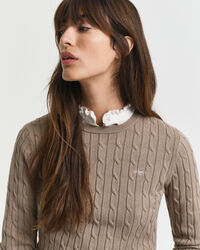 Joustopuuvillainen palmikkoneulepusero, jossa pyöreä pääntie