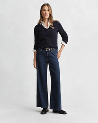 Joustava puuvillapalmikkoneule, jossa v‑pääntie