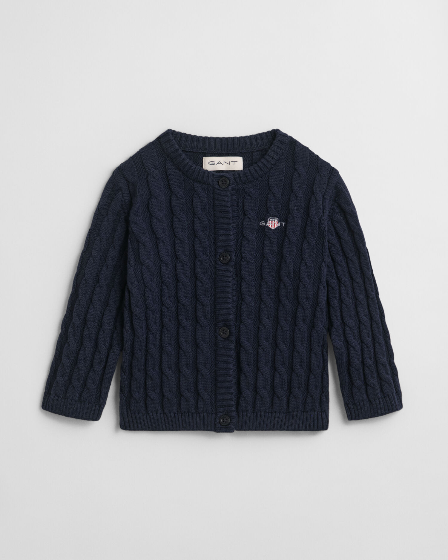 Baby-malliston puuvillainen Shield-palmikkoneuletakki