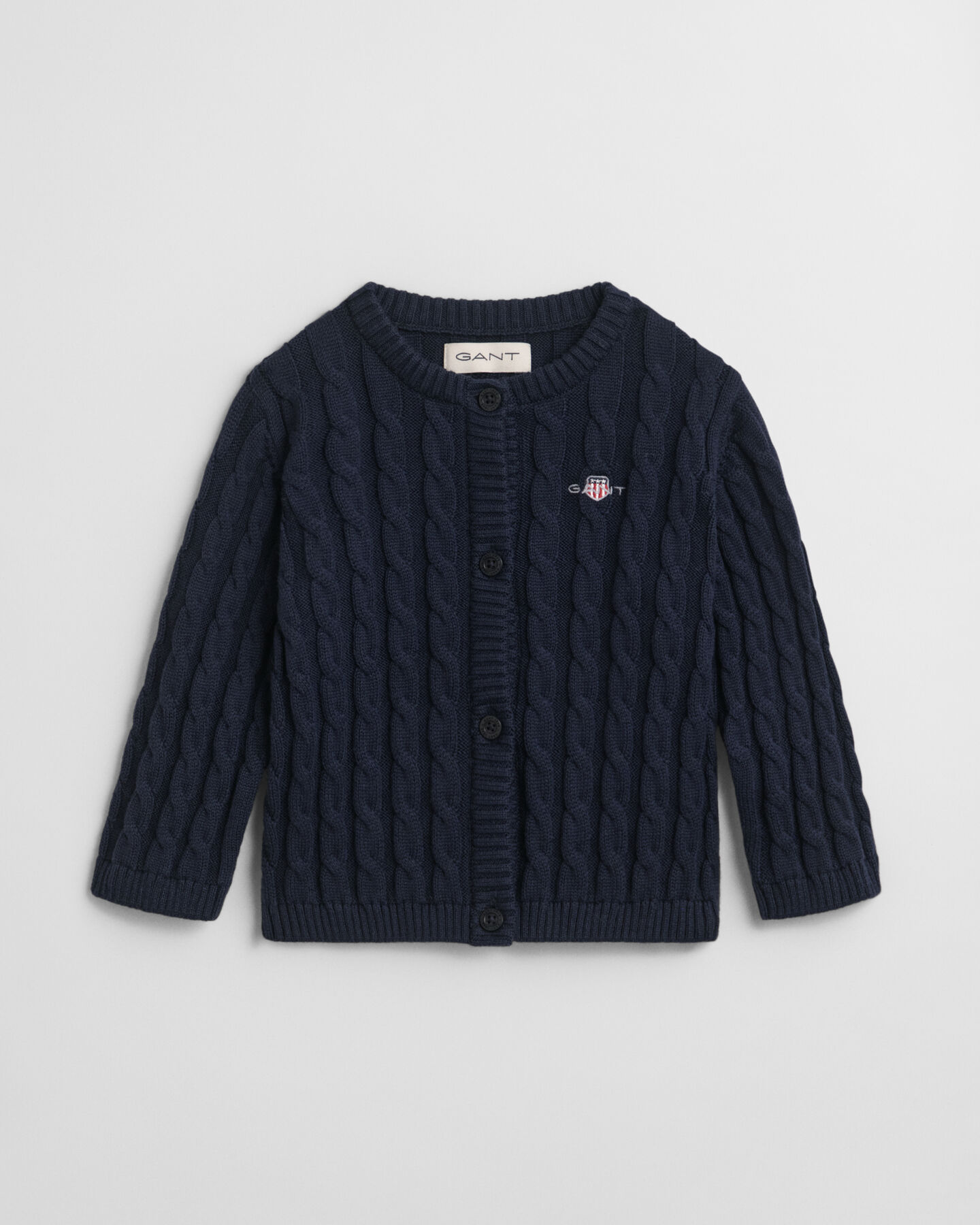 Baby-malliston puuvillainen Shield-palmikkoneuletakki