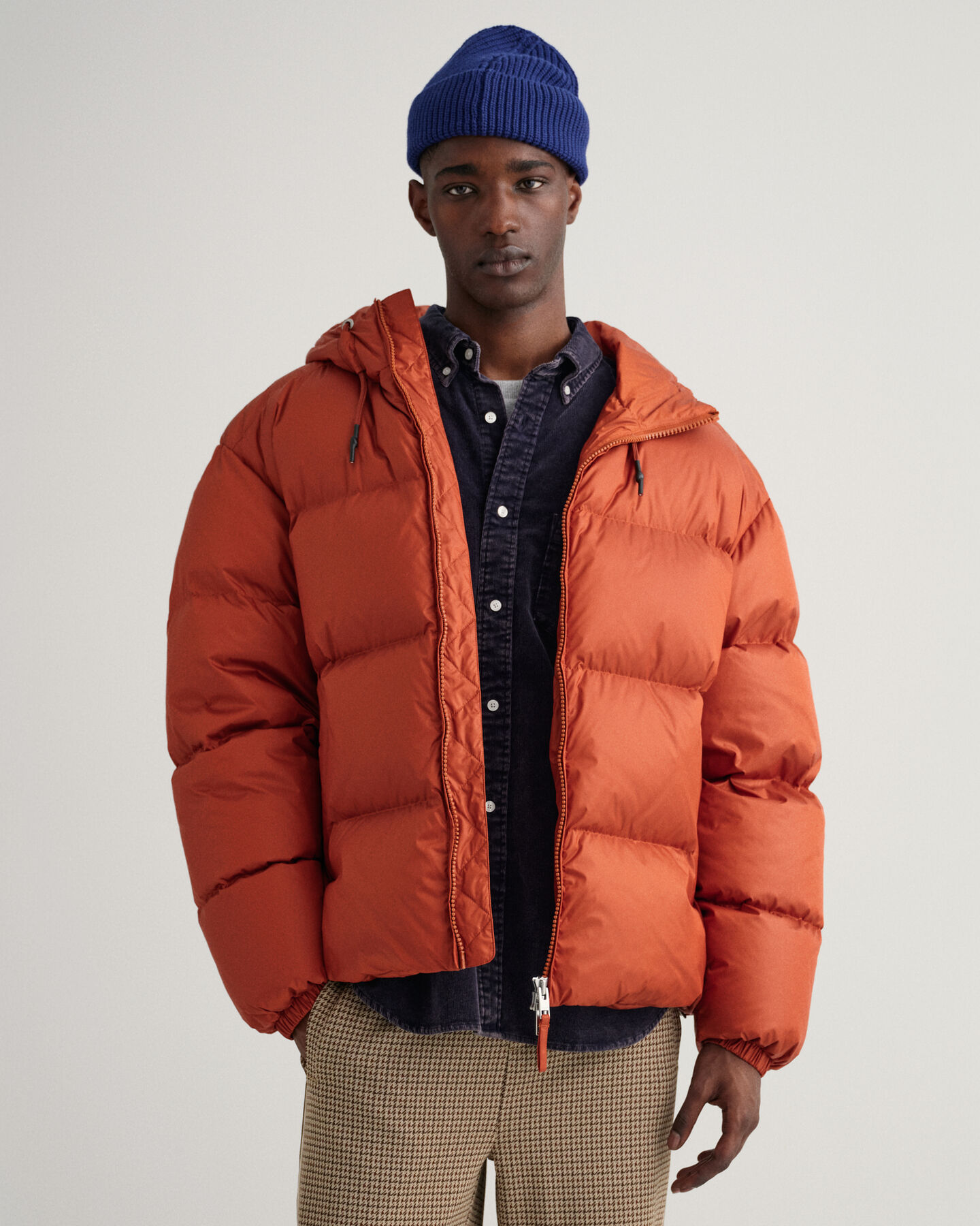 Kiiltävä toppatakki