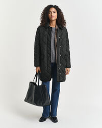 Vakosamettisomisteinen tikkitakki