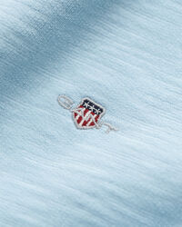 Teens-malliston slubipuuvillainen Shield-collegepaita