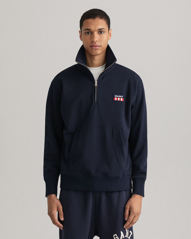 Retro Flag ‑neulepusero puolivetoketjulla