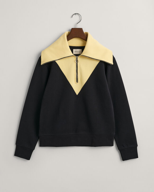 Oversized fit -mitoitettu collegepaita, jossa vetoketju p&auml;&auml;ntiell&auml; ja v&auml;ripintoja