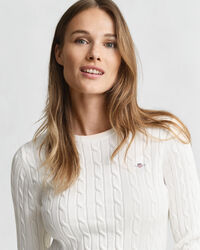 Joustopuuvillainen palmikkoneulepusero, jossa pyöreä pääntie