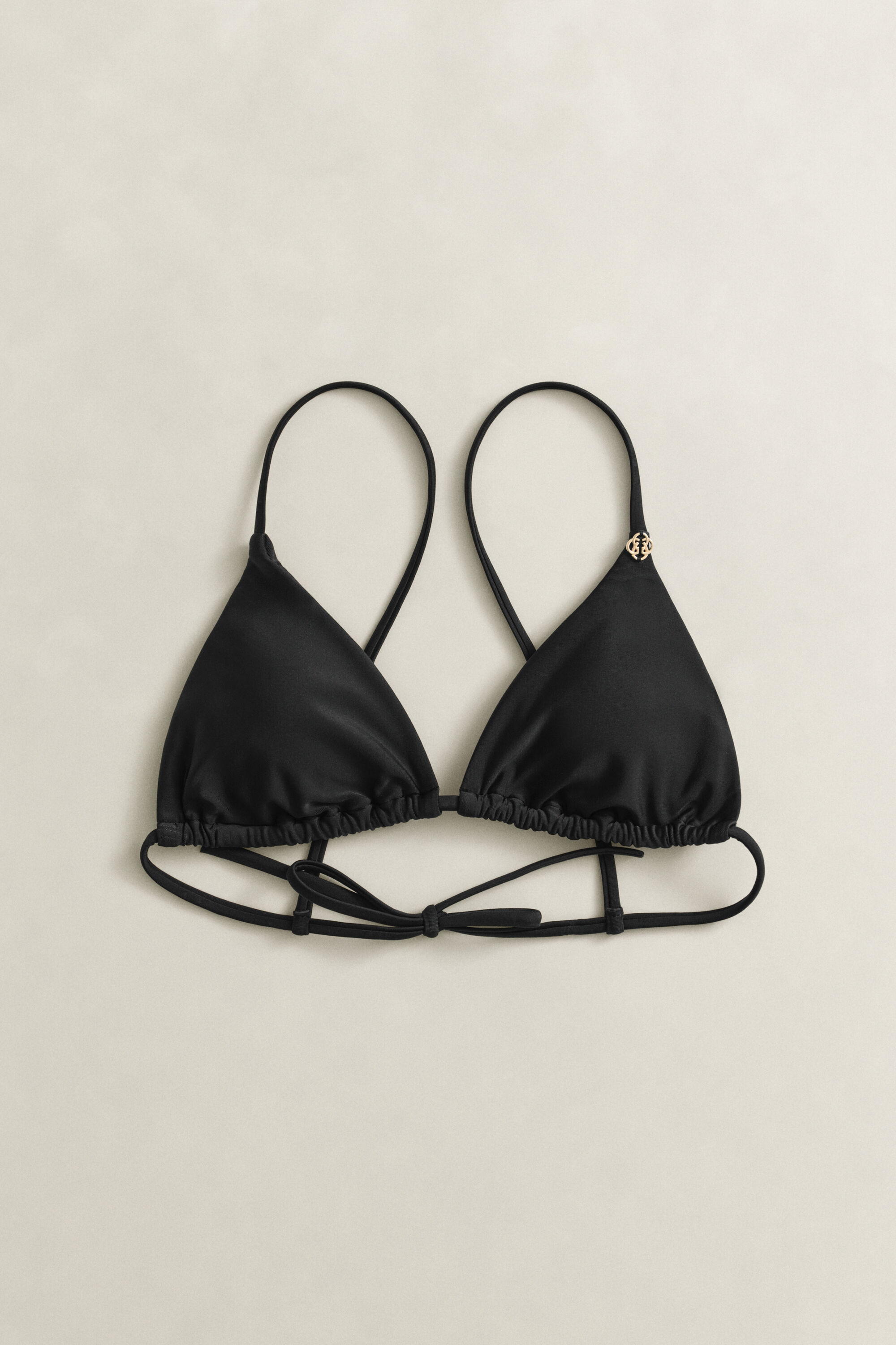 Topattu kolmiobikiniyläosa