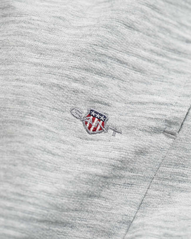 Teens-malliston slubipuuvillaiset Shield-collegeshortsit