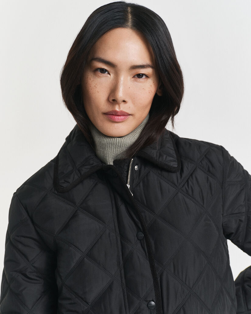 Vakosamettisomisteinen tikkitakki