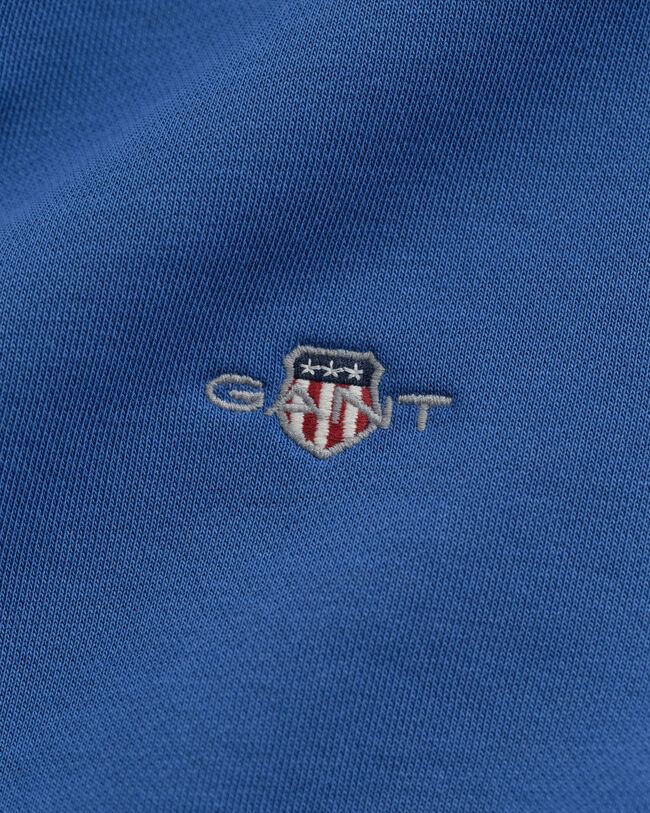 Shield-collegepaita, jossa pyöreä pääntie