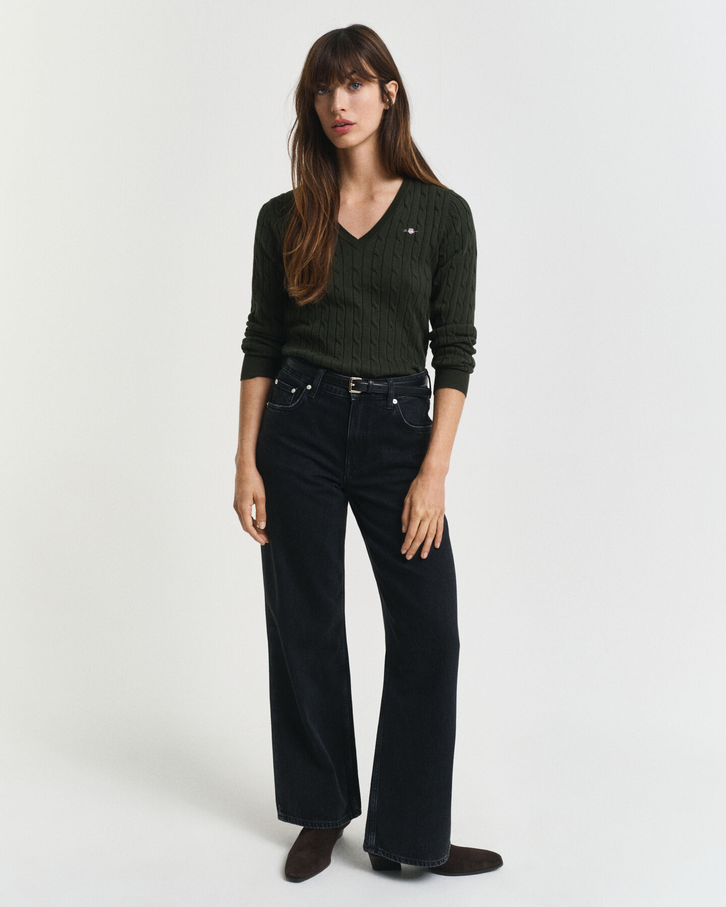 Joustava puuvillapalmikkoneule, jossa v‑pääntie