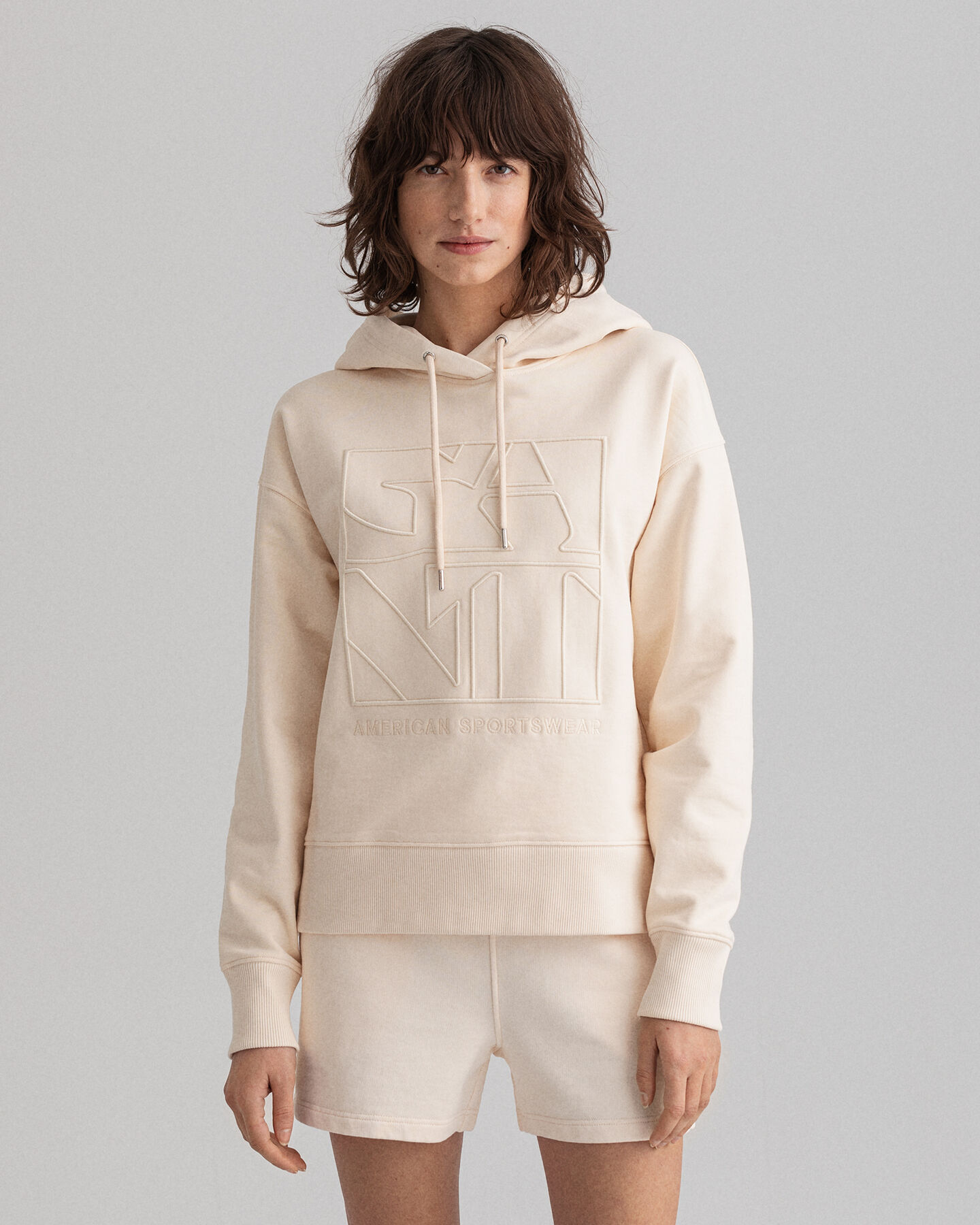 Kirjailtu Tonal Quadrat -huppari