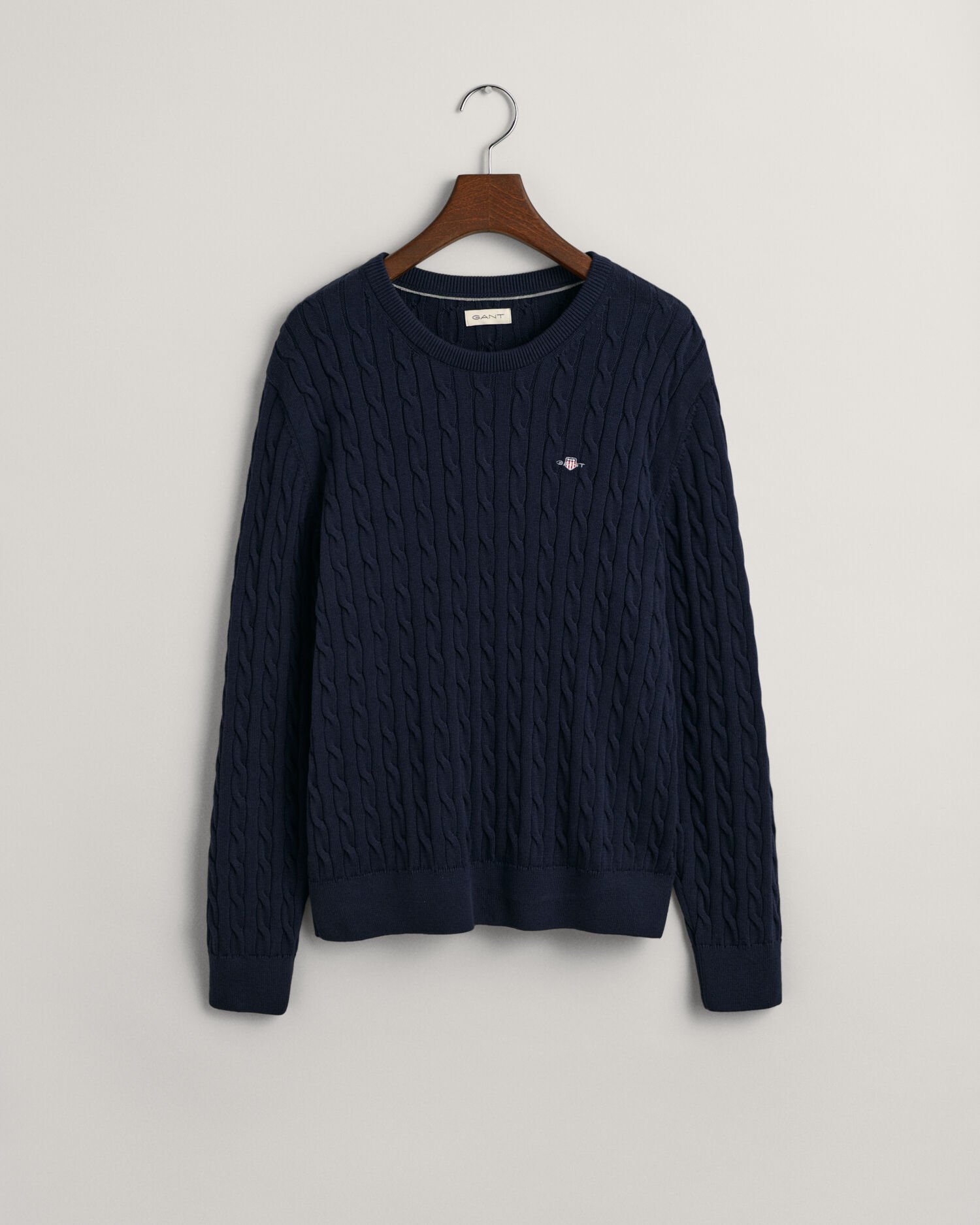 Teens-malliston puuvillainen Shield-palmikkoneulepusero, jossa pyöreä pääntie