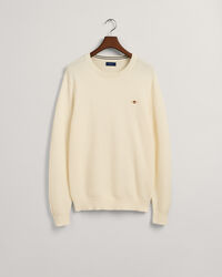 Kohopintainen puuvillaneulepusero, jossa py&ouml;re&auml; p&auml;&auml;ntie