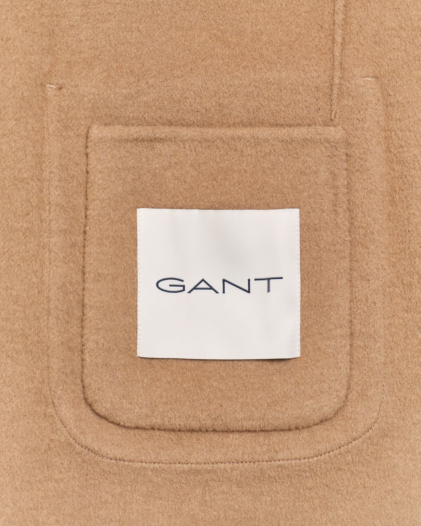 Käsin tikattu klubitakki