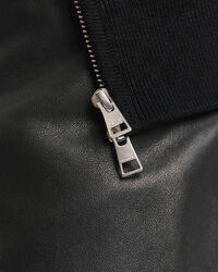 Kohopintainen vetoketjullinen puuvillaneuletakki