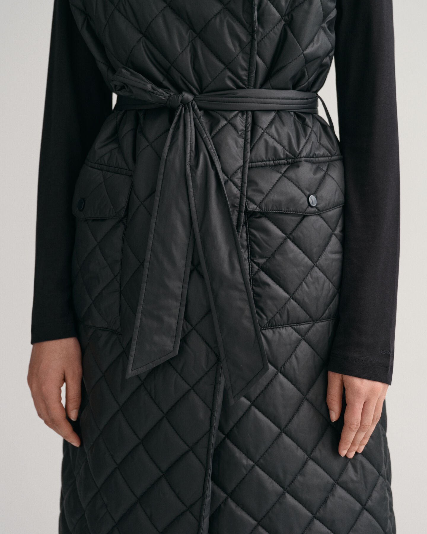 Pitk&auml; tikkiliivi