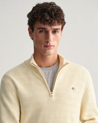 Raidallinen kohopintainen vetoketjukauluksellinen puuvillaneule