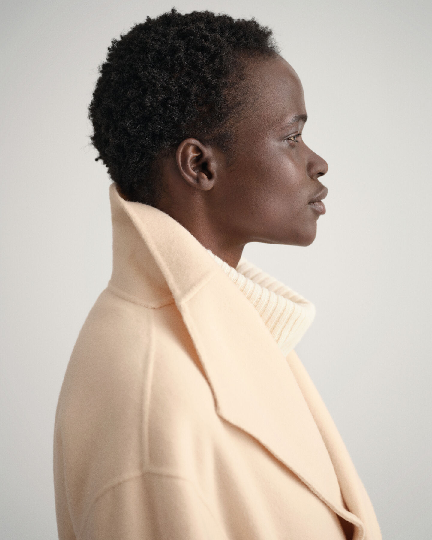 Käsin tikattu takki vyöllä