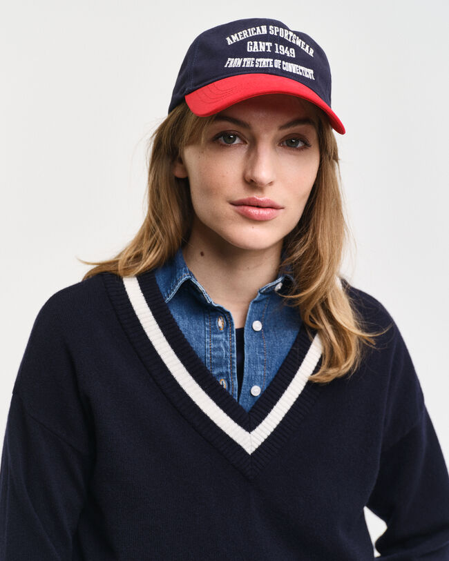 Kontrastivärinen v‑neulepusero erittäin hienoa lampaanvillaa