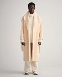 Käsin tikattu takki vyöllä