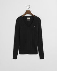 Joustava puuvillapalmikkoneule, jossa v‑pääntie