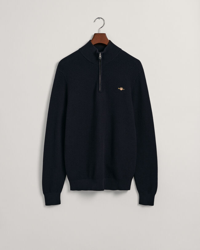 Kohopintainen puuvillaneulepusero, jossa vetoketjullinen pääntie