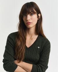 Joustava puuvillapalmikkoneule, jossa v‑pääntie