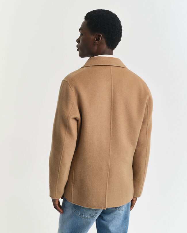 Käsin tikattu klubitakki