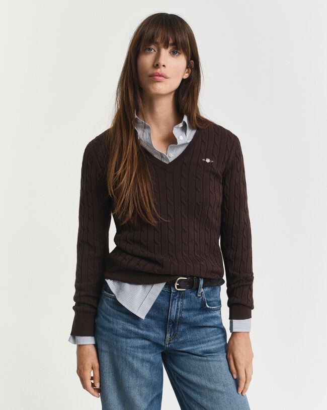 Joustava puuvillapalmikkoneule, jossa v‑pääntie