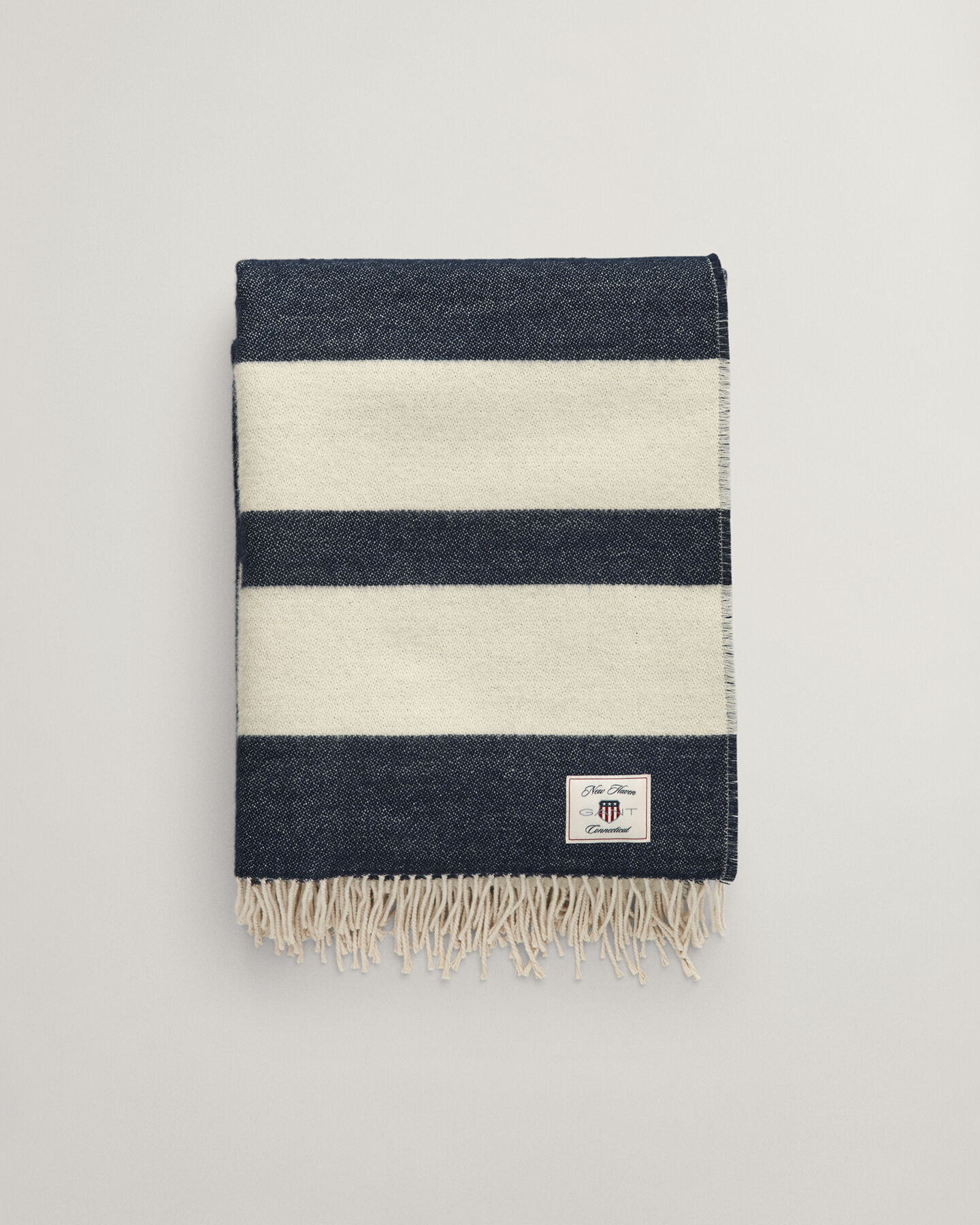 Raidallinen villainen torkkupeitto