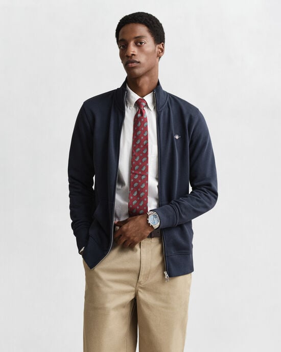 Vetoketjullinen Shield‑collegepaita