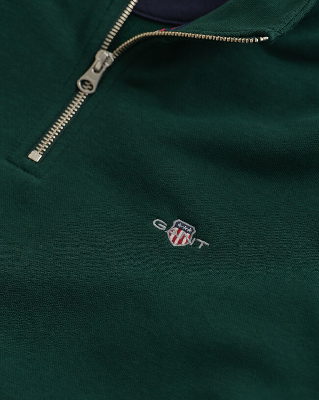 Shield‑collegepaita, jossa vetoketju pääntiellä