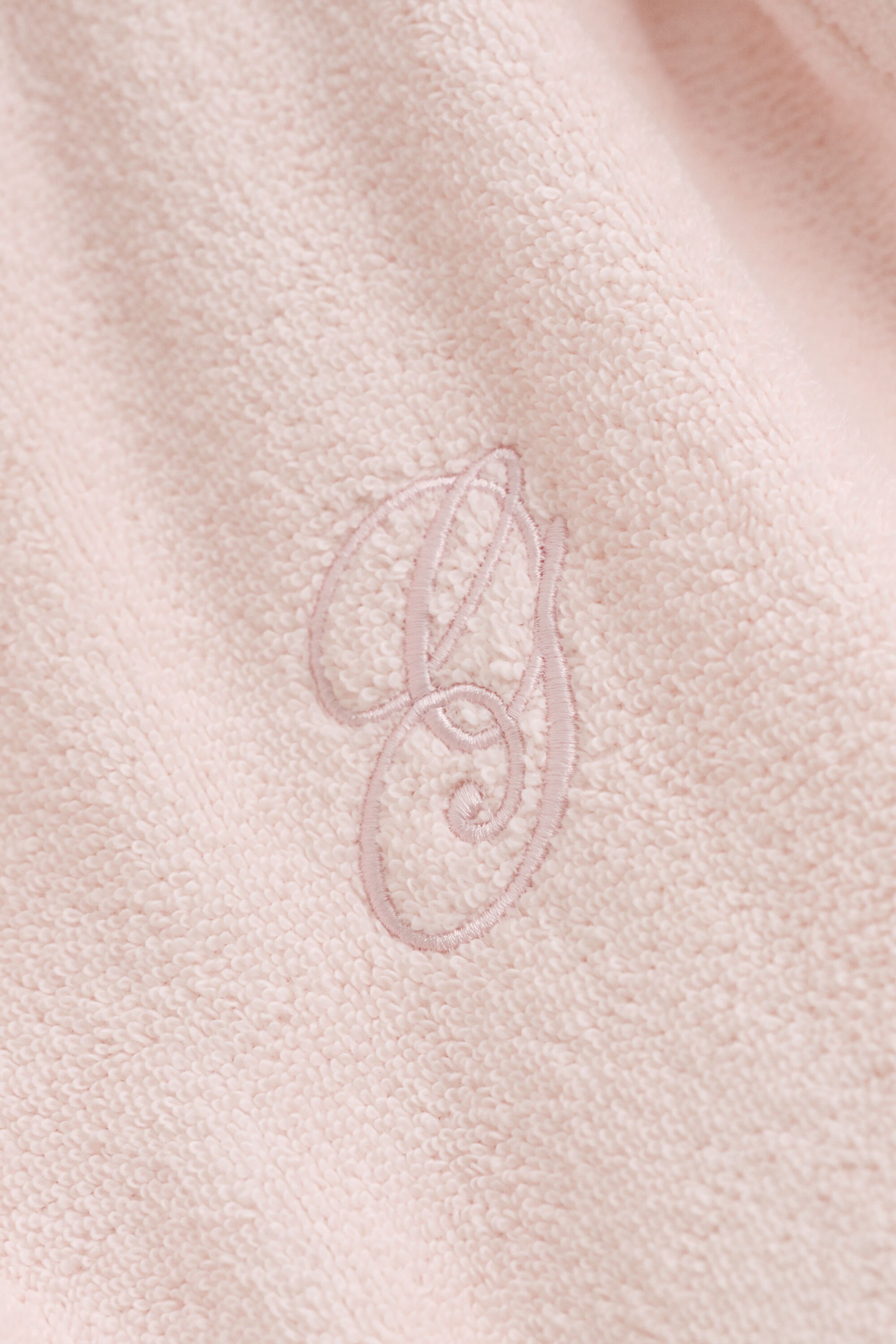 Kirjailtu kylpytakki