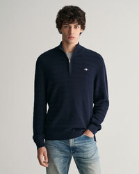 Raidallinen kohopintainen vetoketjukauluksellinen puuvillaneule