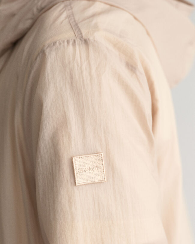 Taskuun pakattava kevyt Windbreaker-takki