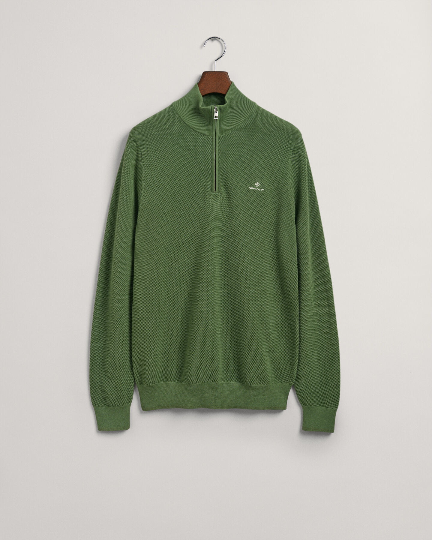 Puuvillapikeekankaasta tehty neulepusero puolivetoketjulla