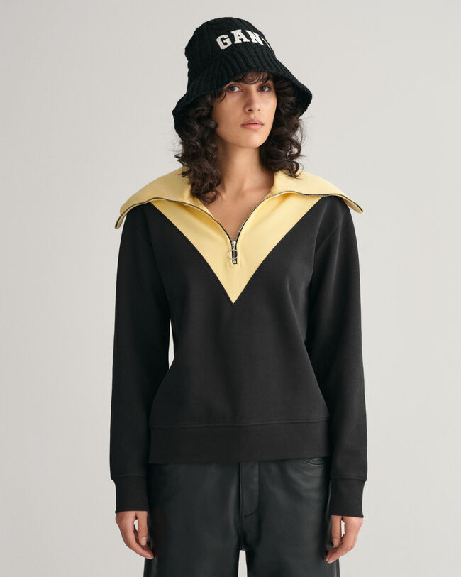 Oversized fit -mitoitettu collegepaita, jossa vetoketju p&auml;&auml;ntiell&auml; ja v&auml;ripintoja