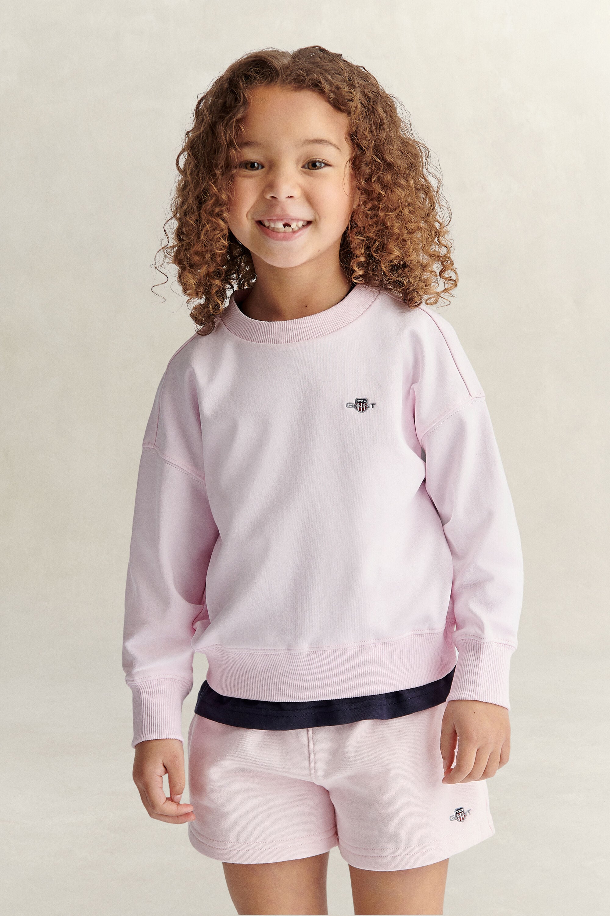Girls-malliston oversized fit ‑mitoitettu Shield-collegepaita