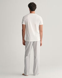 Raidalliset pyjamahousut ja t‑paita lahjapakkauksessa