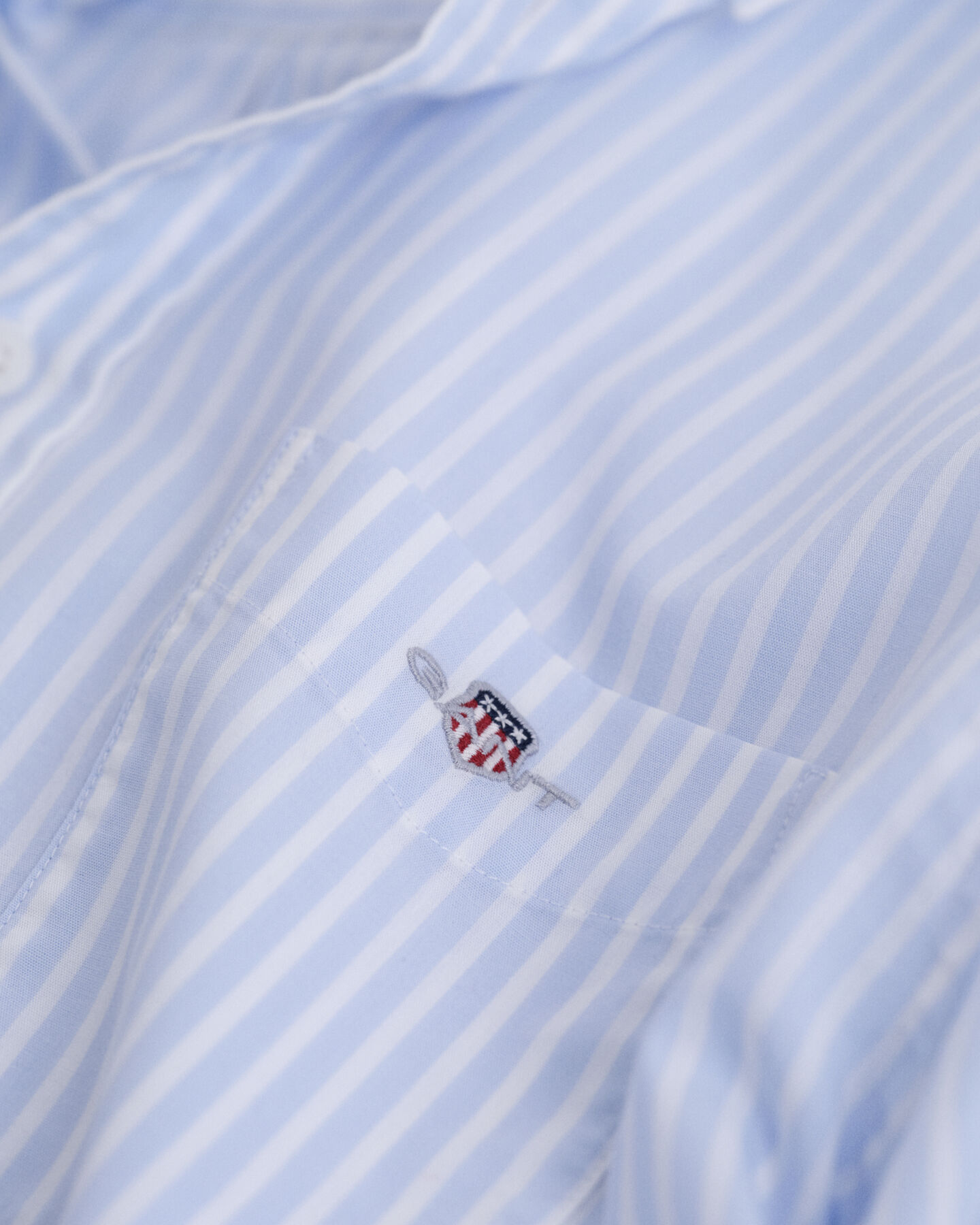 Teens-malliston raidallinen Shield-popliinipaita