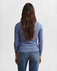 Joustopuuvillainen palmikkoneulepusero, jossa pyöreä pääntie